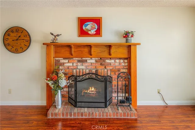a view of a fireplace with wooden floor