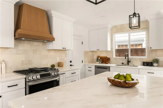 a bedroom with a bed and a view of living room