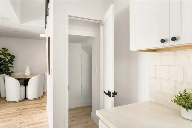 a bedroom with a bed and a mirror