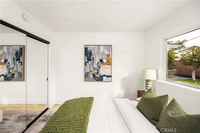 a bedroom with a bed and a couch