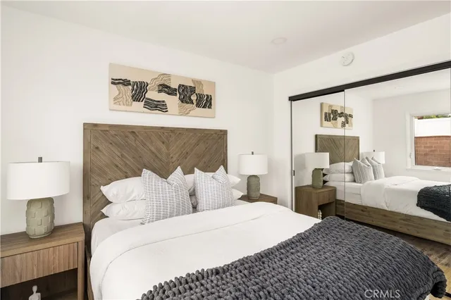 a bedroom with a bed and a couch