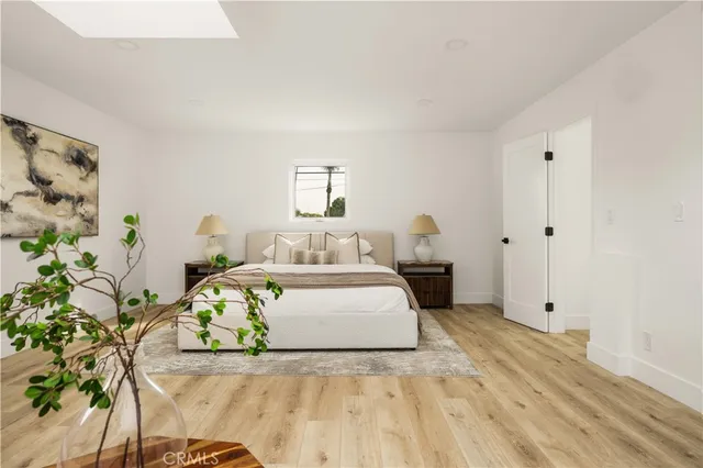 a bathroom with a bathtub and mirror