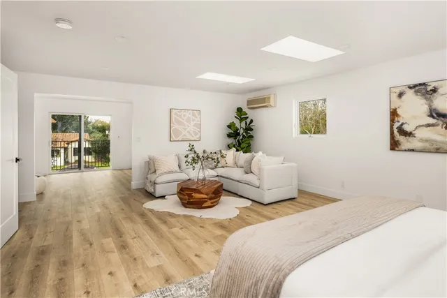 a view of a room with wooden floor and window