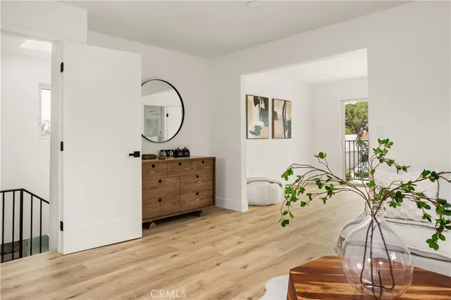 a view of a patio with table and chairs and potted plants