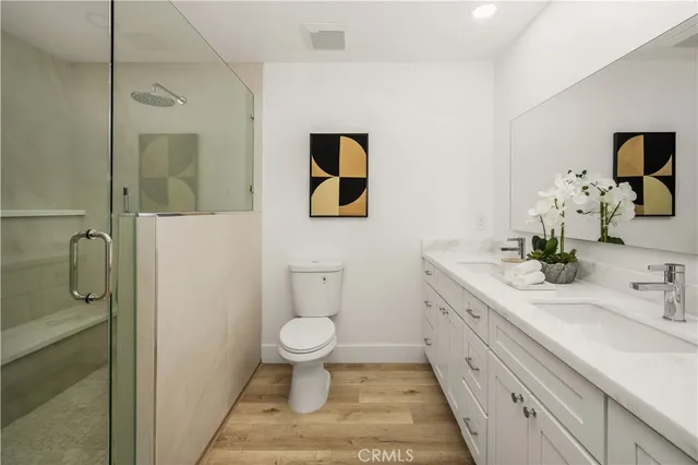 a patio with table and chairs and potted plants