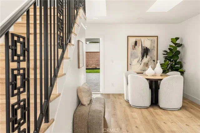 a view of living room filled with furniture and a potted plant