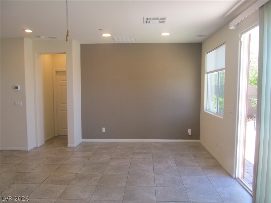 2157 Rio Rancho Pointe Place Henderson, NV 89002 - Photo 9 of 24 A well-lit interior space features tile flooring and convenient sliding door access to the outdoors.