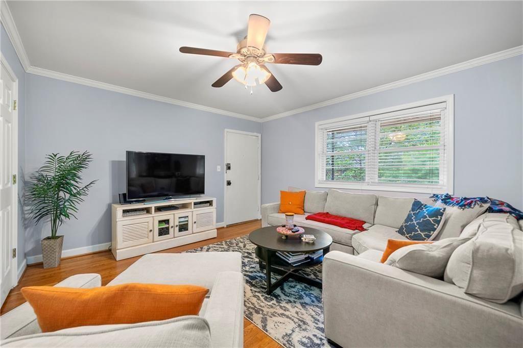 a living room with furniture and a flat screen tv