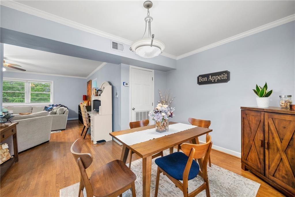 3660 Peachtree Road Northeast, Unit 6A Atlanta, GA 30319 - Photo 4 of 13 a view of a dining room with furniture window and wooden floor