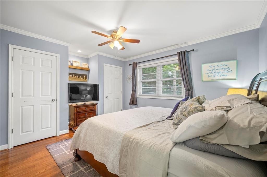 3660 Peachtree Road Northeast, Unit 6A Atlanta, GA 30319 - Photo 9 of 13 a bedroom with a bed and a dresser