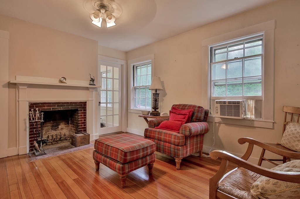 13 Spaulding Road Shirley, MA 01464 - Photo 19 of 27 a living room with furniture a window and a fireplace