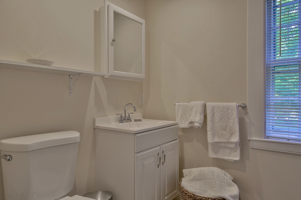 13 Spaulding Road Shirley, MA 01464 - Photo 21 of 27 a bathroom with a sink a toilet and vanity