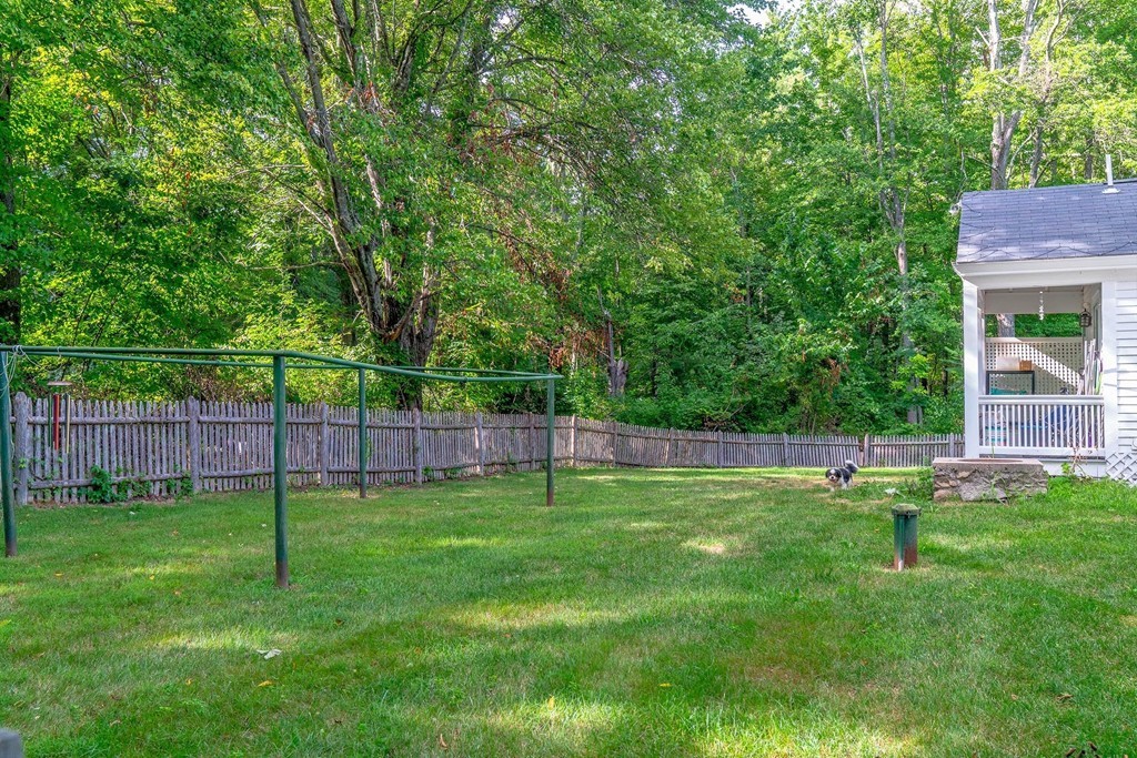 13 Spaulding Road Shirley, MA 01464 - Photo 22 of 27 a view of a backyard with a slide