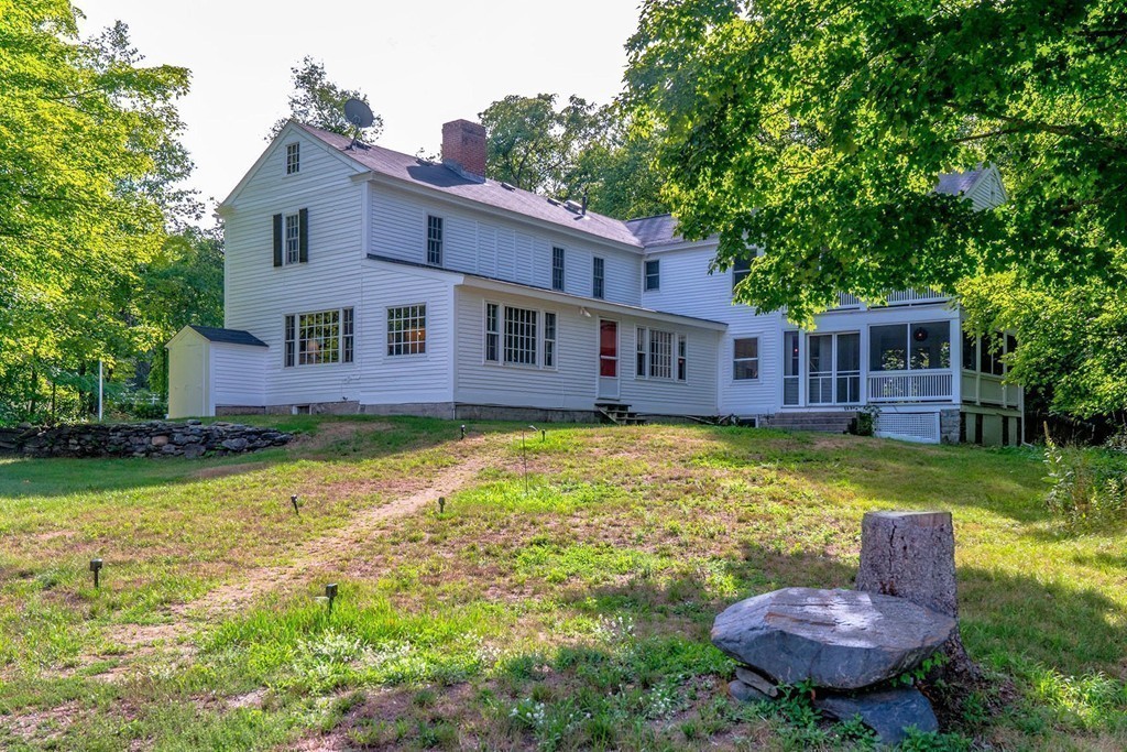 13 Spaulding Road Shirley, MA 01464 - Photo 3 of 27 a view of a house with a backyard