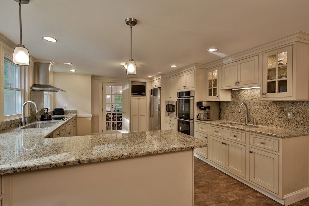 13 Spaulding Road Shirley, MA 01464 - Photo 6 of 27 a kitchen with stainless steel appliances granite countertop a sink a stove and a granite counter tops