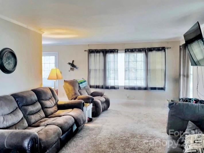 5880 Tabernacle Road Lancaster, SC 29720 - Photo 13 of 22 a living room with furniture and a large window