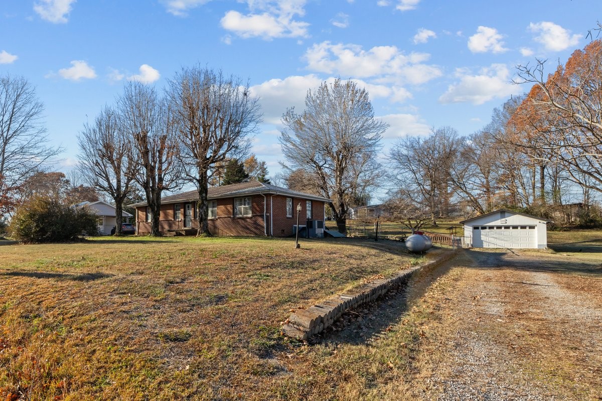 2138 River Road Clarksville, TN 37040 - Photo 1 of 27 a view of a yard with a house in the background