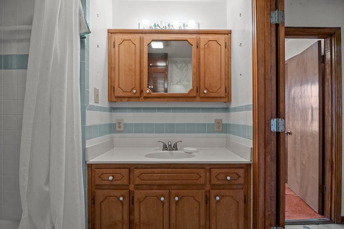 2138 River Road Clarksville, TN 37040 - Photo 16 of 27 a sink with a mirror
