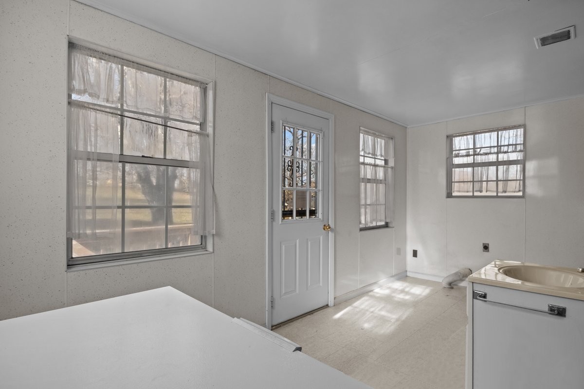 2138 River Road Clarksville, TN 37040 - Photo 19 of 27 a view of empty room with windows and cabinet