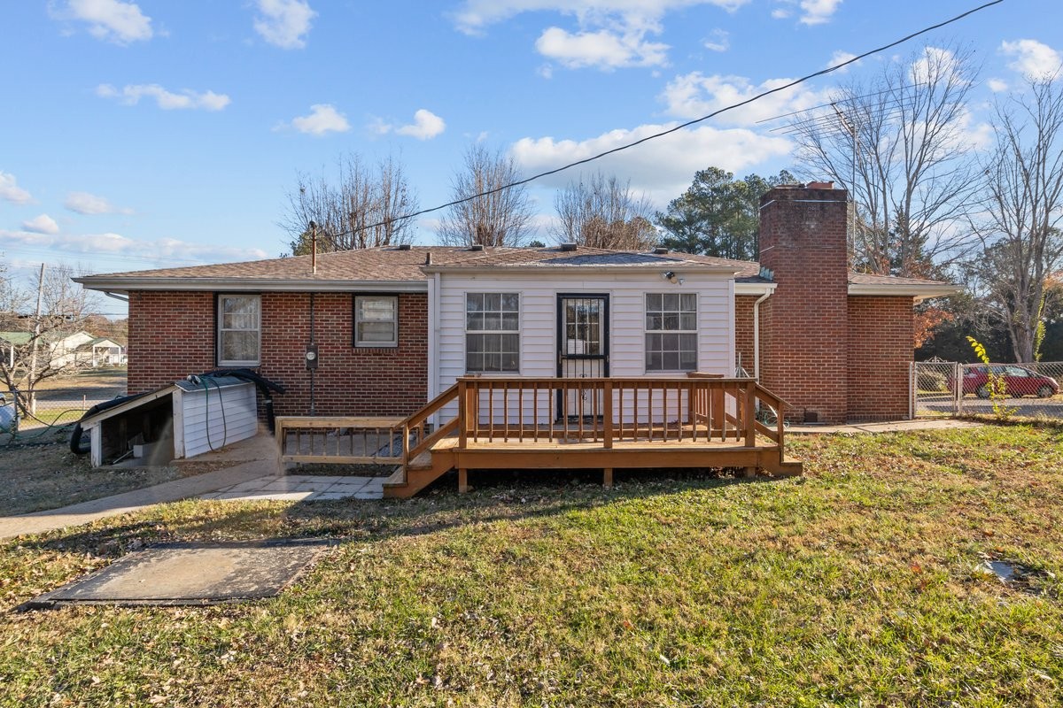 2138 River Road Clarksville, TN 37040 - Photo 21 of 27 a view of a house with a wooden deck and a yard