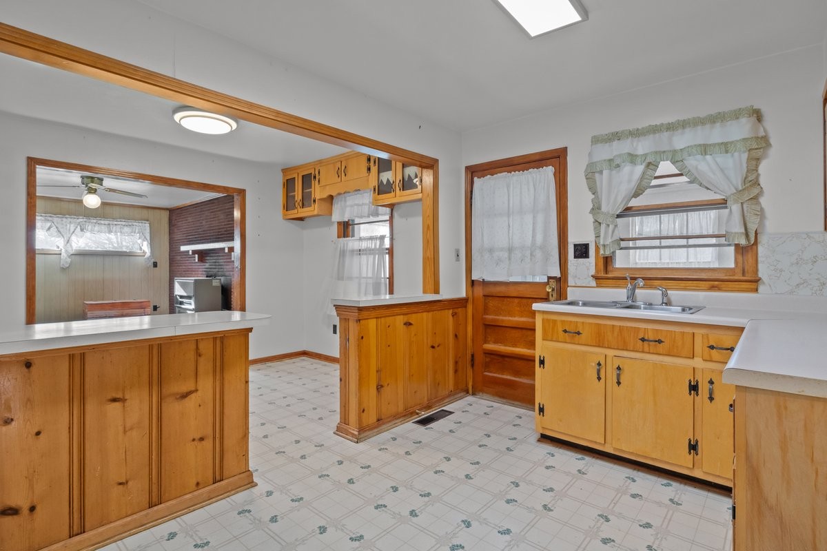 2138 River Road Clarksville, TN 37040 - Photo 7 of 27 a kitchen with wooden cabinets and a stove