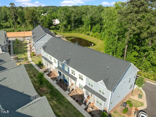 a view of a brick house with many windows