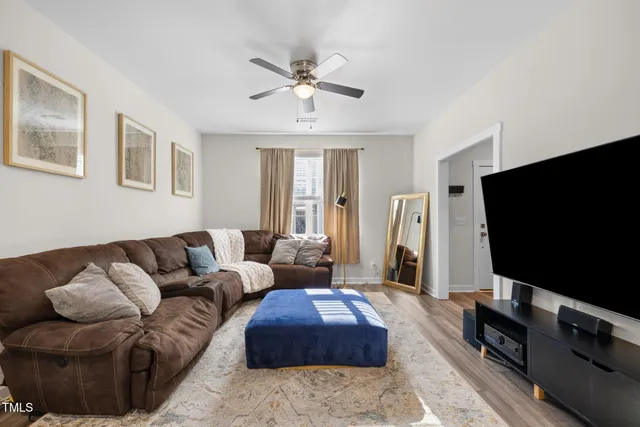 a bedroom with furniture and a mirror