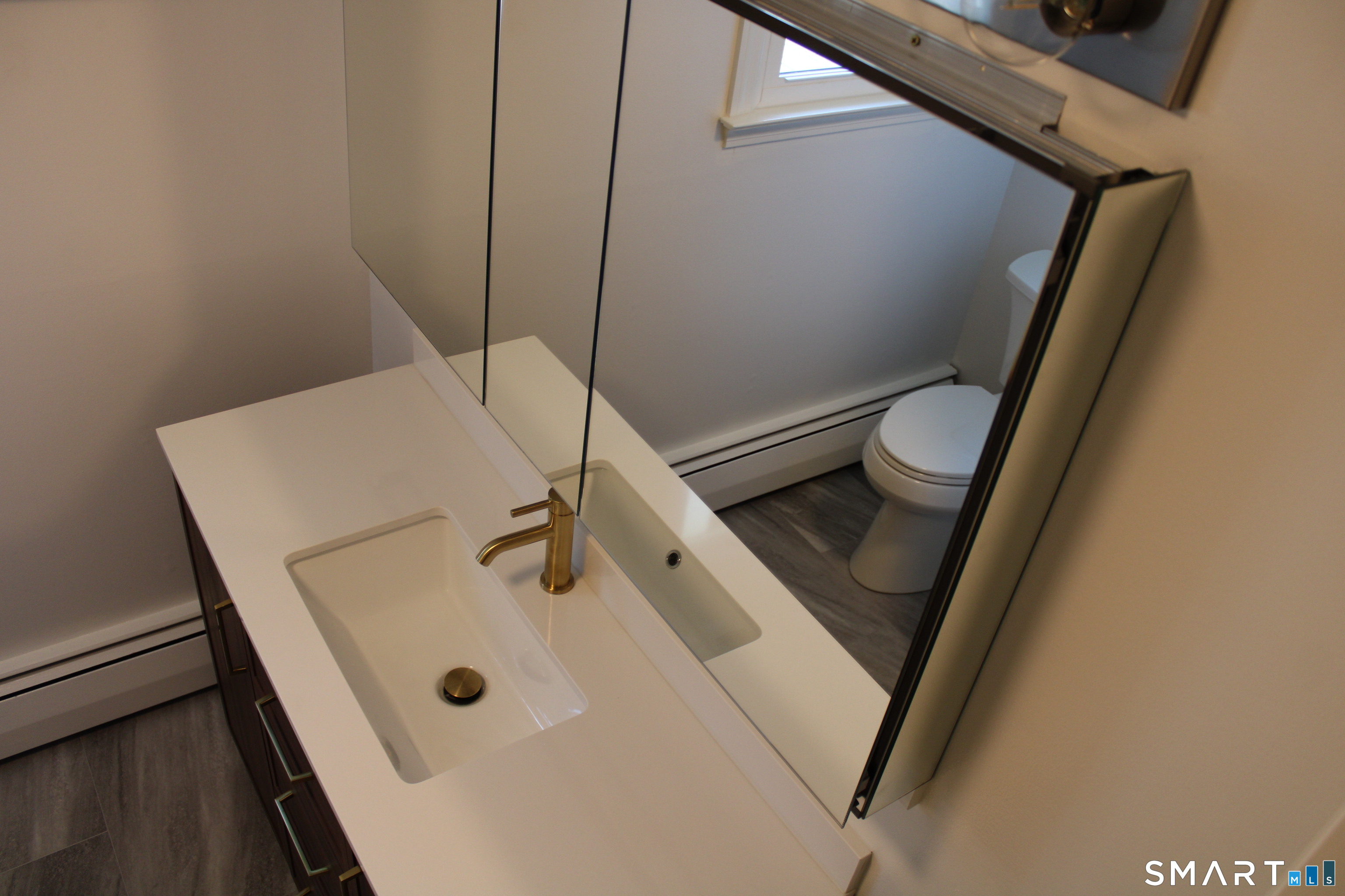 441 Opening Hill Road Madison, CT 06443 - Photo 16 of 33 a bathroom with a sink and toilet