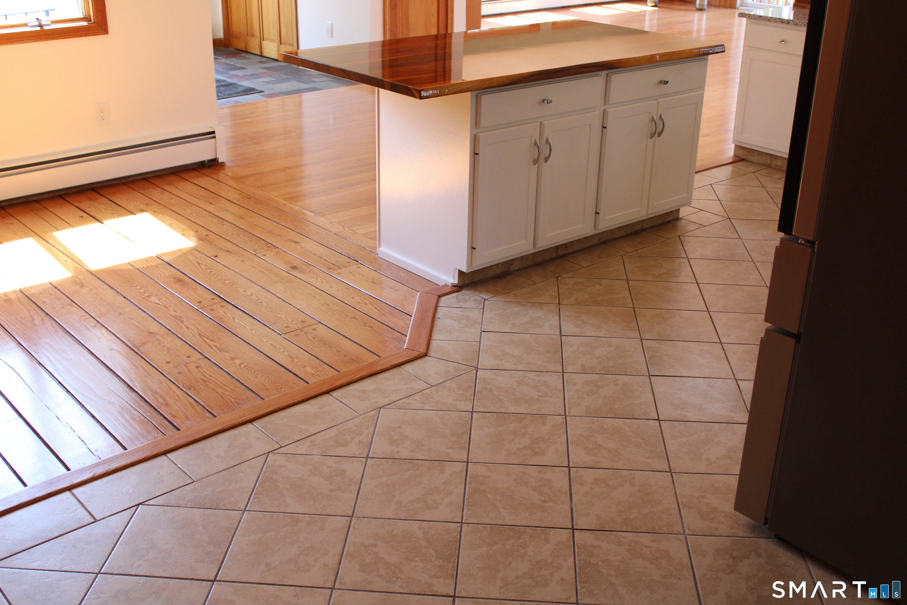 441 Opening Hill Road Madison, CT 06443 - Photo 19 of 33 a view of a utility room with wooden floor