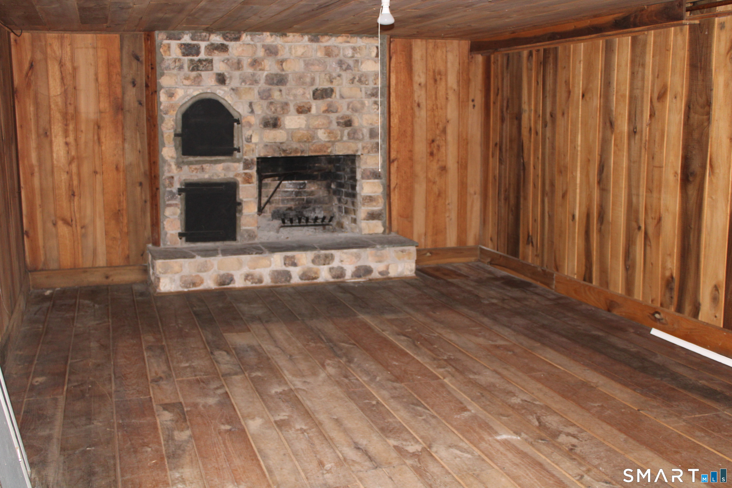 441 Opening Hill Road Madison, CT 06443 - Photo 20 of 33 a view of fireplace and wooden floor