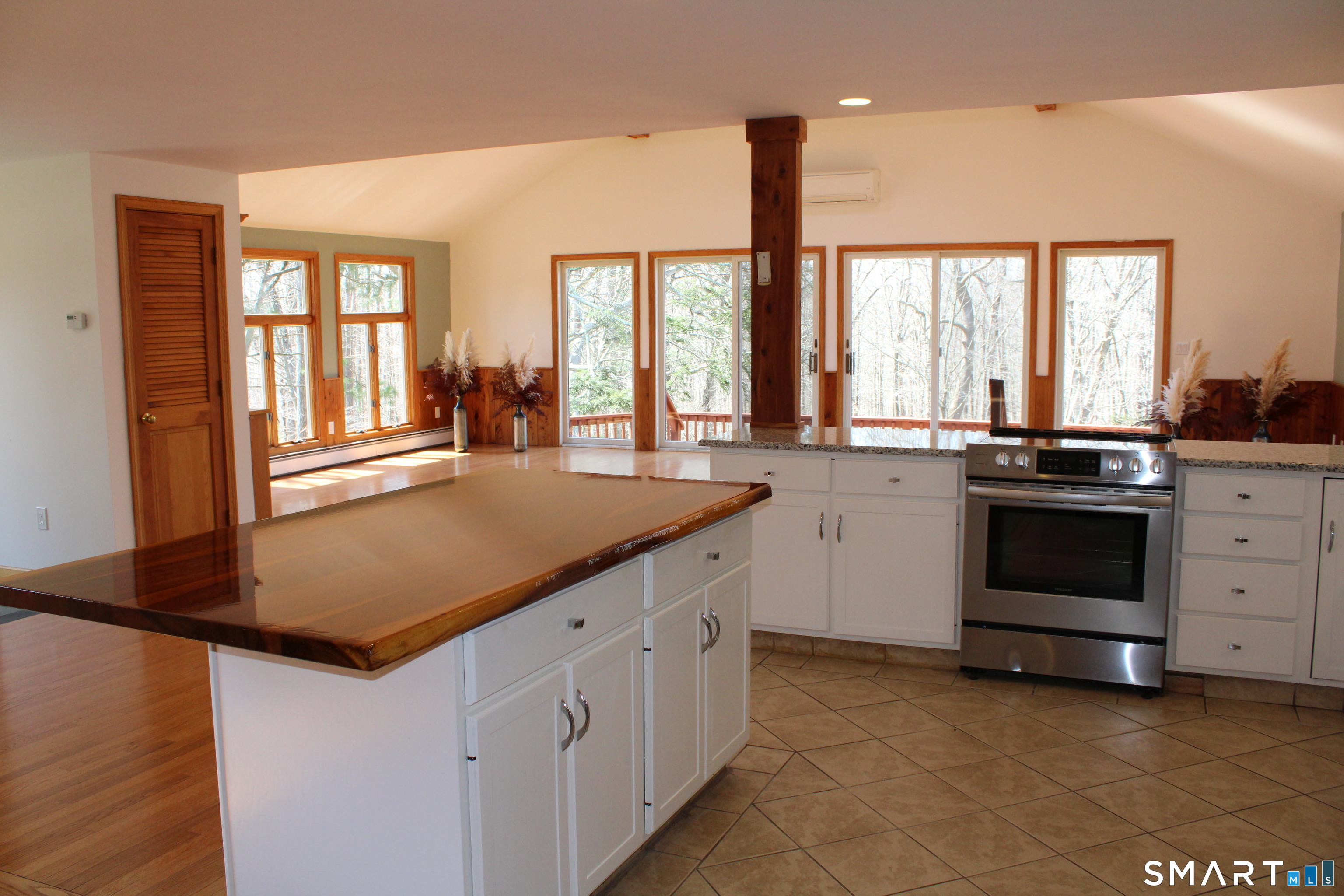 441 Opening Hill Road Madison, CT 06443 - Photo 25 of 33 a kitchen with stainless steel appliances granite countertop a sink a stove and a refrigerator