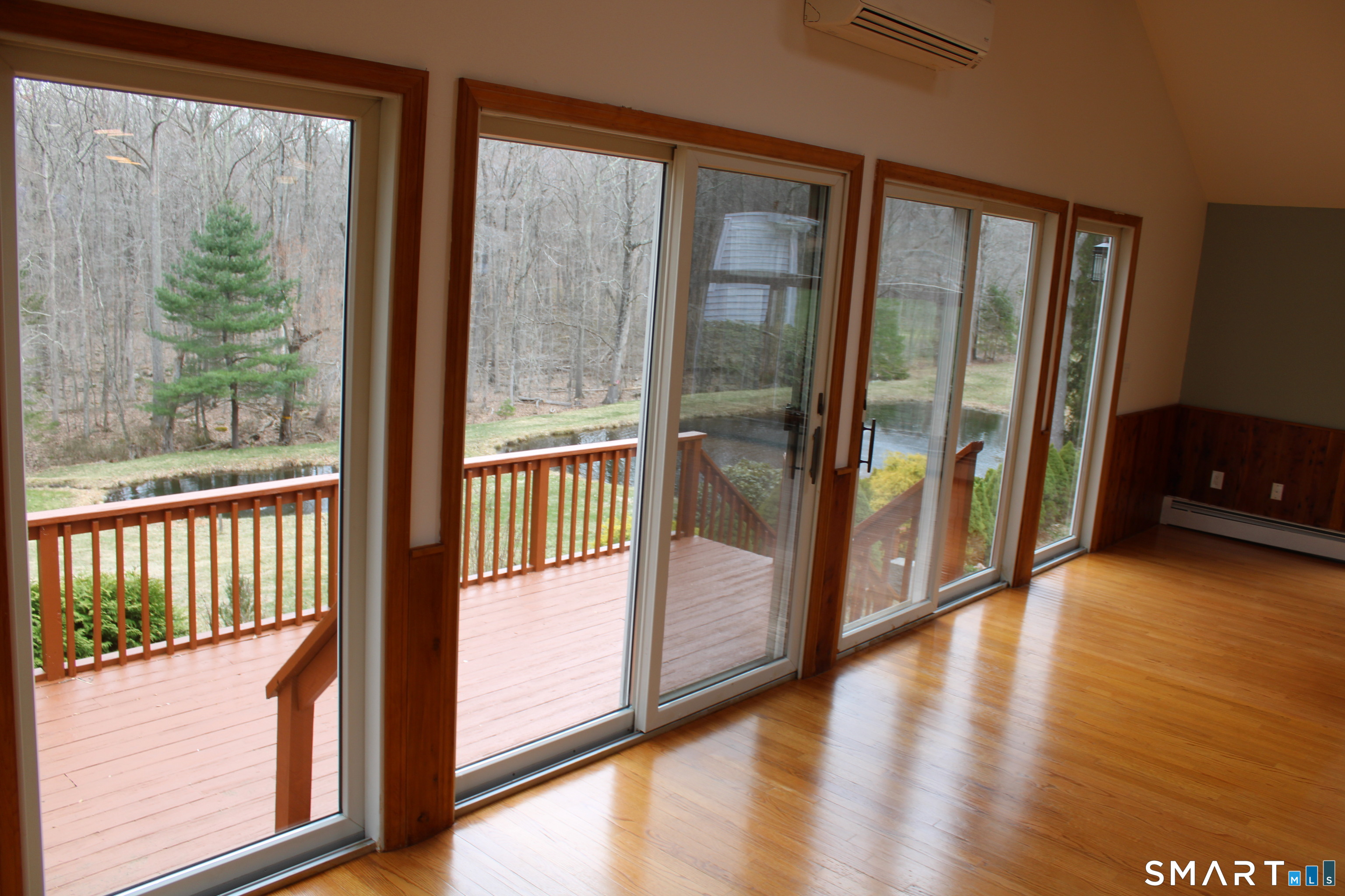 441 Opening Hill Road Madison, CT 06443 - Photo 5 of 33 a view of a glass door and the balcony