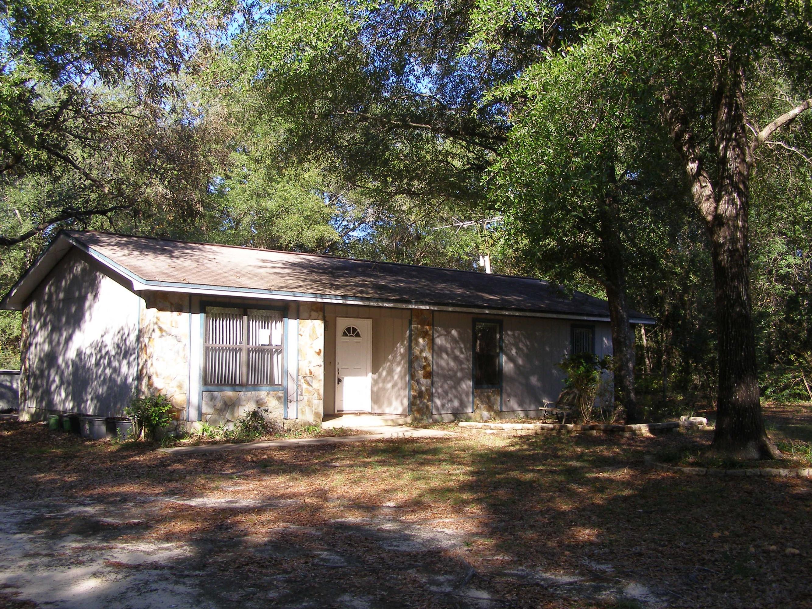 4263 Poverty Creek Road Crestview, FL 32539 - Photo 1 of 13 a front view of house with yard