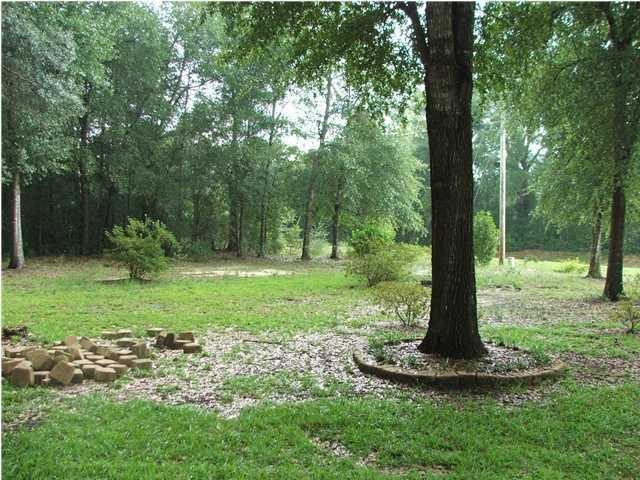 4263 Poverty Creek Road Crestview, FL 32539 - Photo 2 of 13 a view of a fire pit in a park