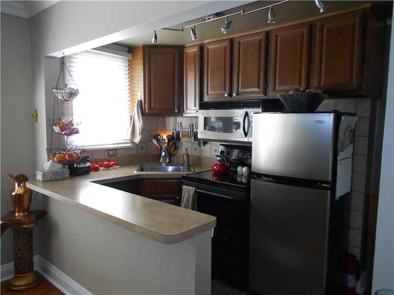 417 Olympia Road Pittsburgh, PA 15211 - Photo 11 of 25 Kitchen. Open with lots of Counterspace Stainless Appliances and Beautiful Wood Cabinetry