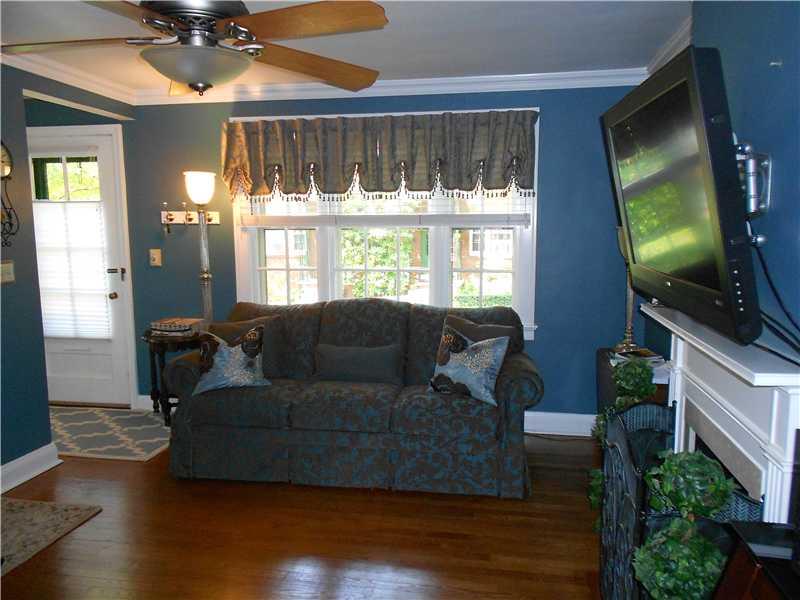417 Olympia Road Pittsburgh, PA 15211 - Photo 5 of 25 Living Room. Large Window and Gleaming Hardwood Floors Throughout