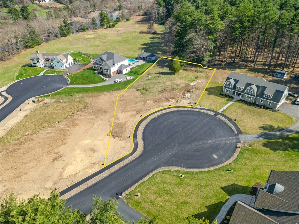 4 Ruby Circle Topsfield, MA 01983 - Photo 4 of 9 an aerial view of a swimming pool with a yard