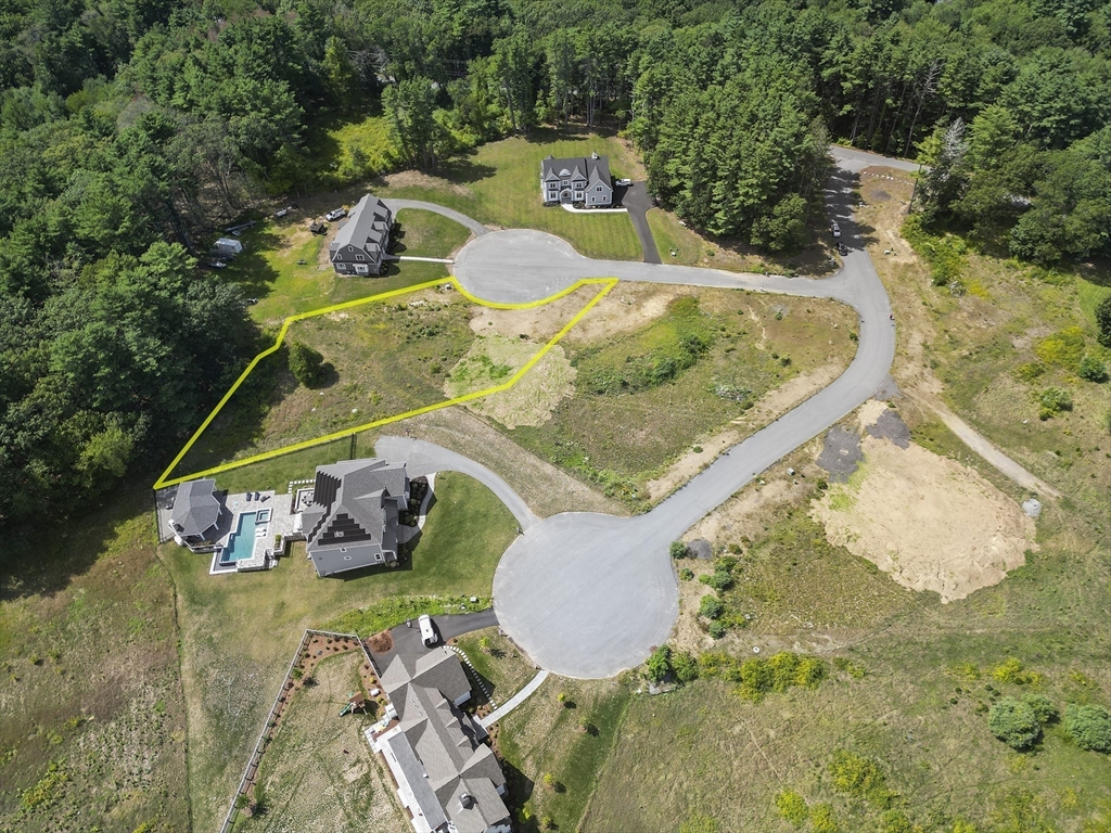 4 Ruby Circle Topsfield, MA 01983 - Photo 5 of 9 a view of a swimming pool with lawn chairs and plants