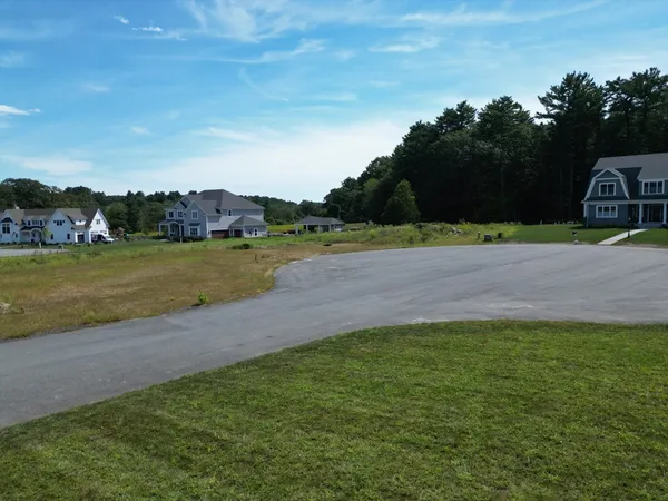 a view of a yard with a lake view
