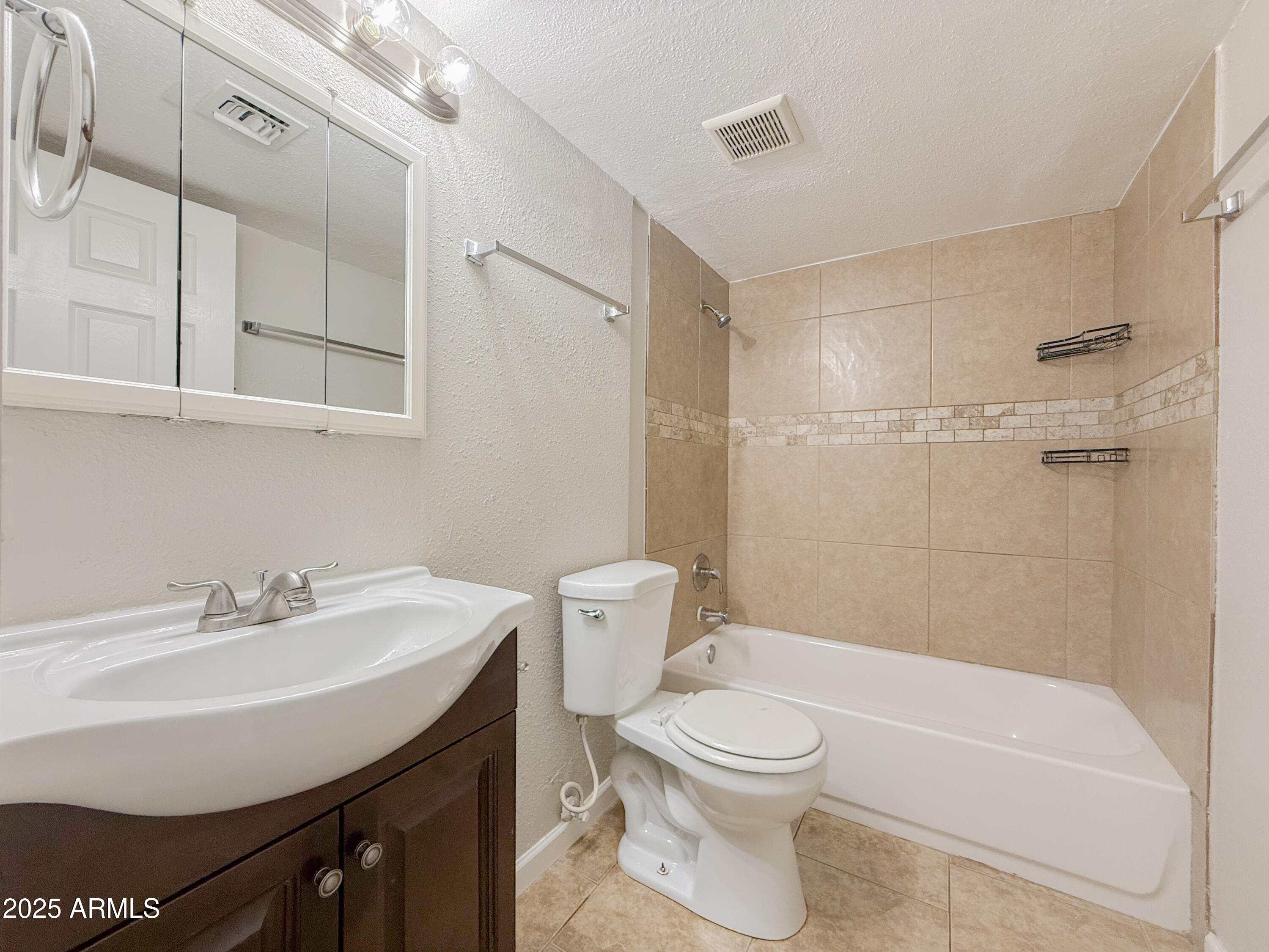 349 North 11th Street, Unit 107 Phoenix, AZ 85006 - Photo 12 of 22 a bathroom with a sink a toilet and shower