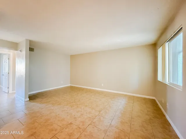a view of an empty room and window