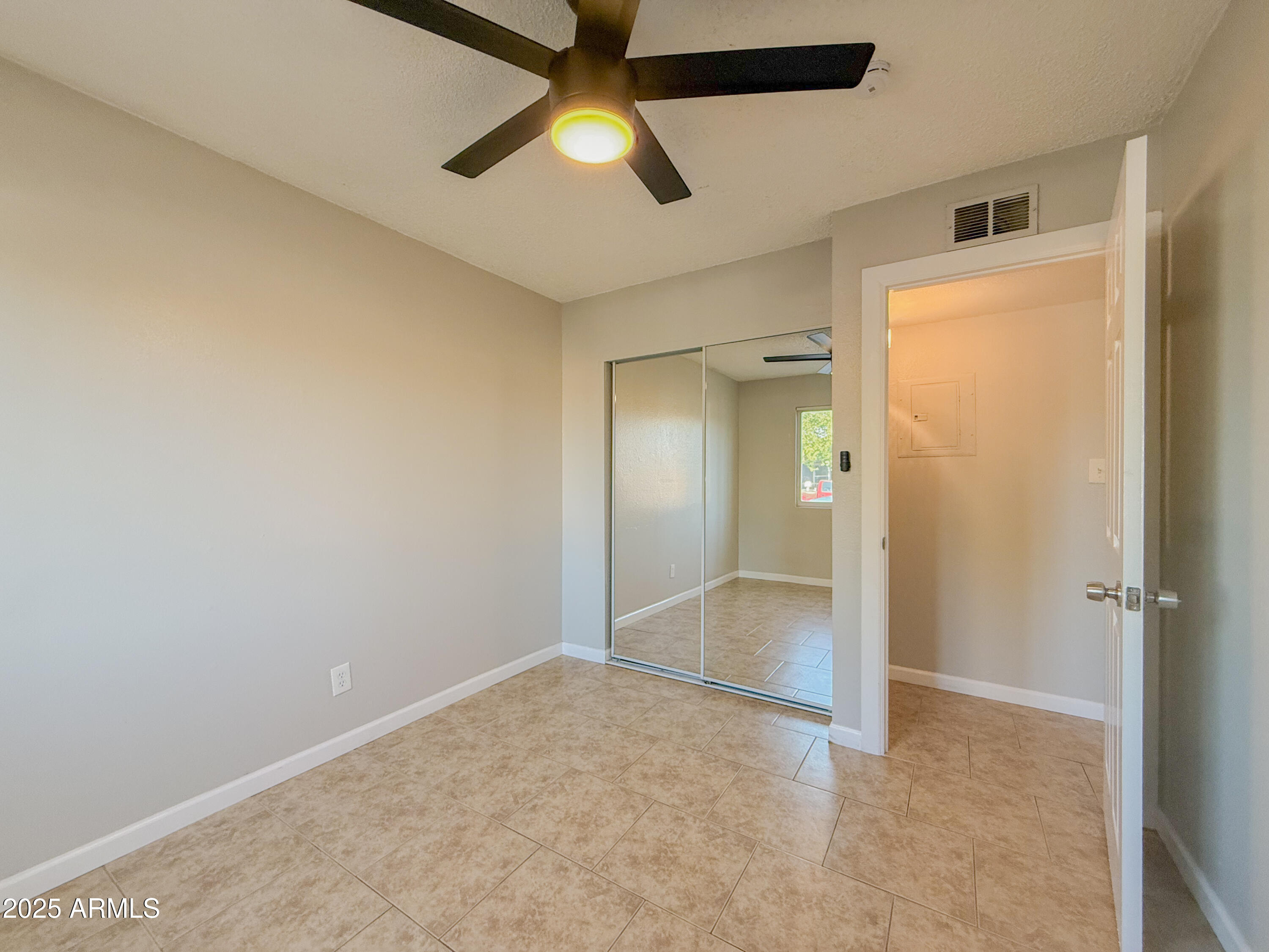 349 North 11th Street, Unit 107 Phoenix, AZ 85006 - Photo 14 of 22 an empty room with fan and entrance