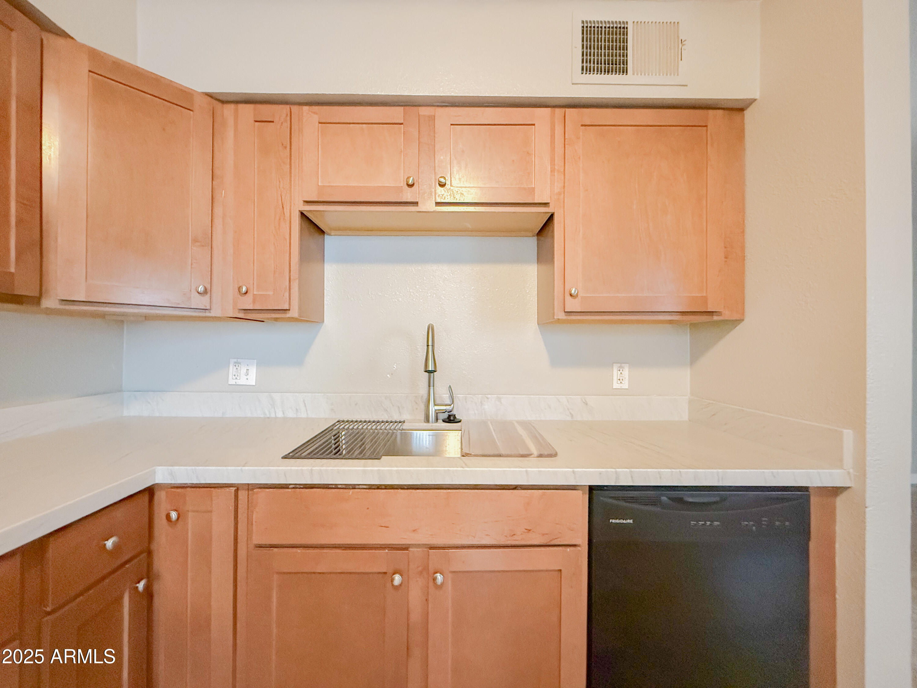 349 North 11th Street, Unit 107 Phoenix, AZ 85006 - Photo 9 of 22 a kitchen with a sink cabinets and a window