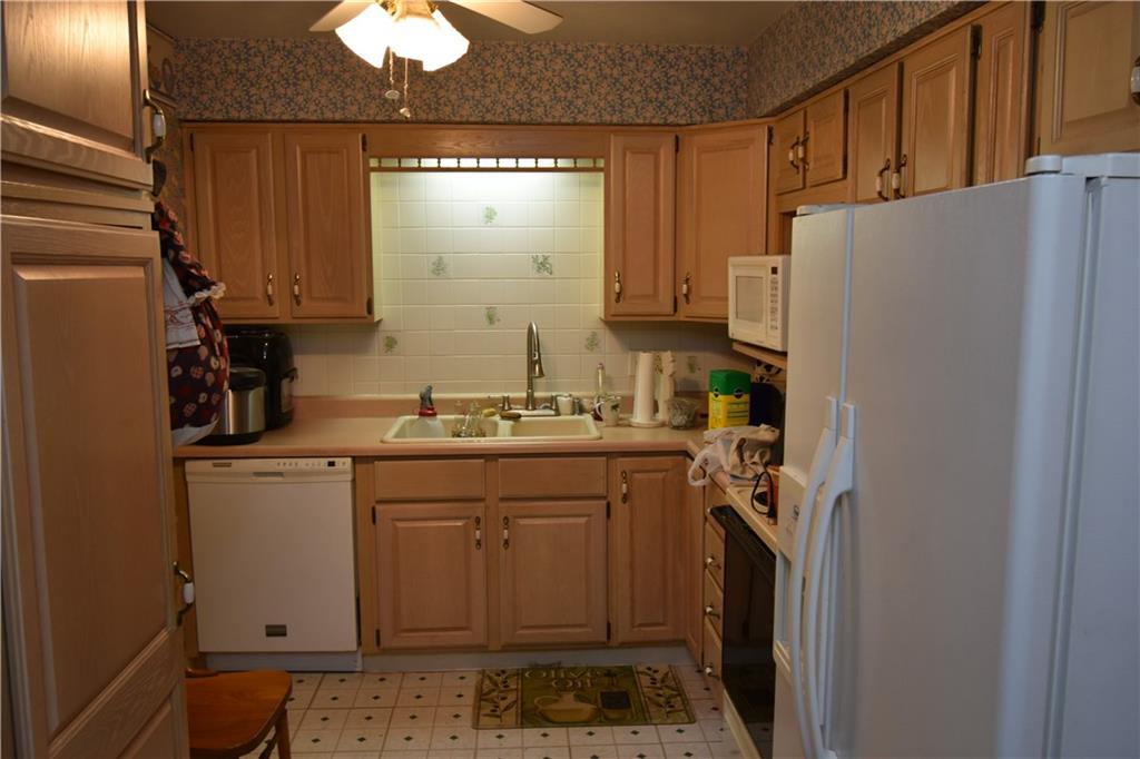 485 North Ben Franklin Road Indiana, PA 15701 - Photo 6 of 13 a utility room with cabinets washer and dryer