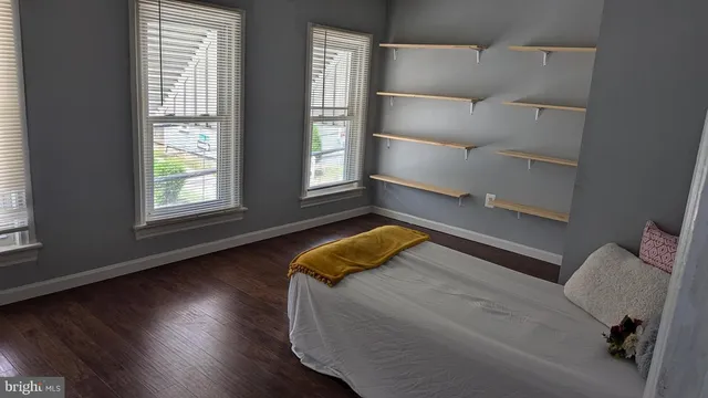 a bedroom with a bed and window