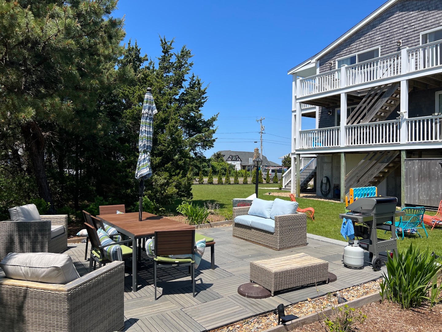 28 Beach Road Oak Bluffs, MA 02557 - Photo 2 of 32 a view of backyard with outdoor seating and kitchen view