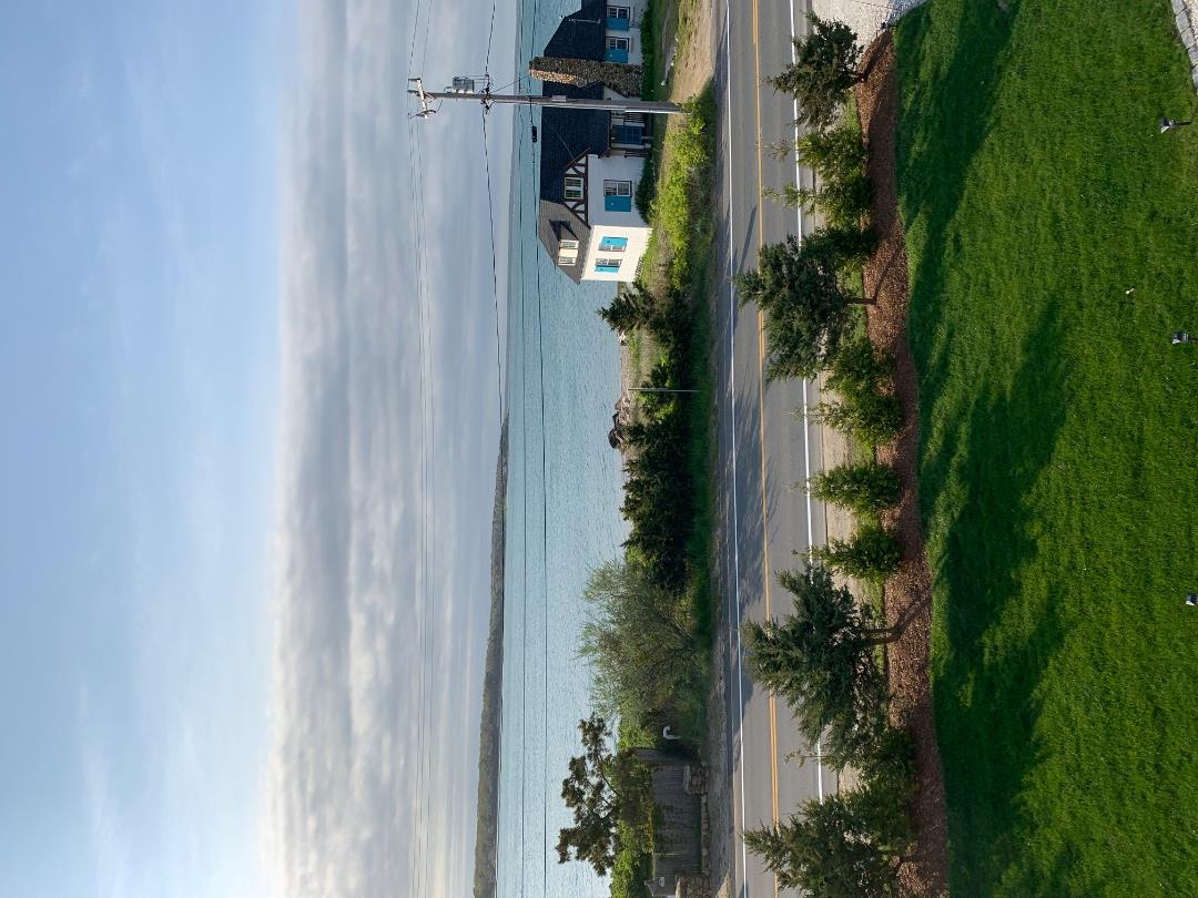 28 Beach Road Oak Bluffs, MA 02557 - Photo 26 of 32 a view of a lake with a big yard