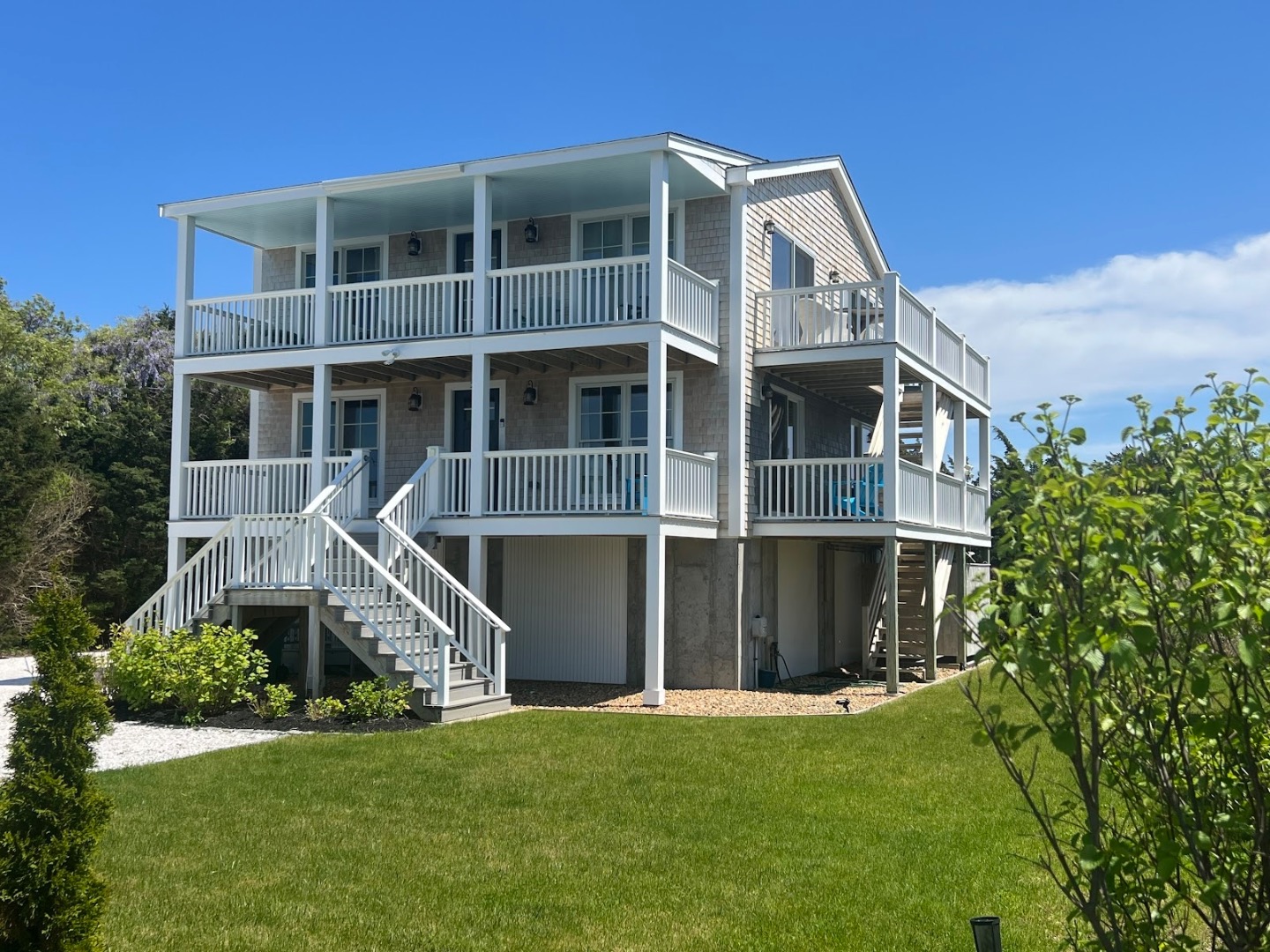 28 Beach Road Oak Bluffs, MA 02557 - Photo 28 of 32 a front view of a house with a yard
