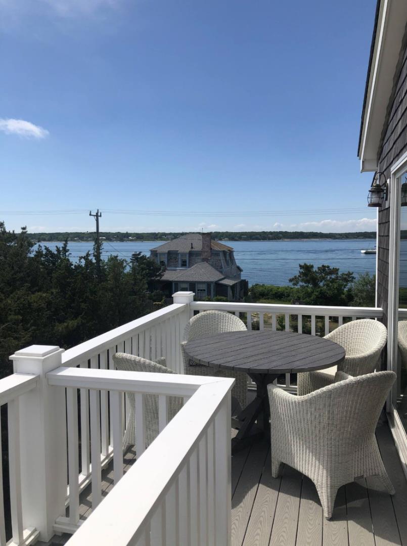 28 Beach Road Oak Bluffs, MA 02557 - Photo 5 of 32 a view of a chairs and table in patio
