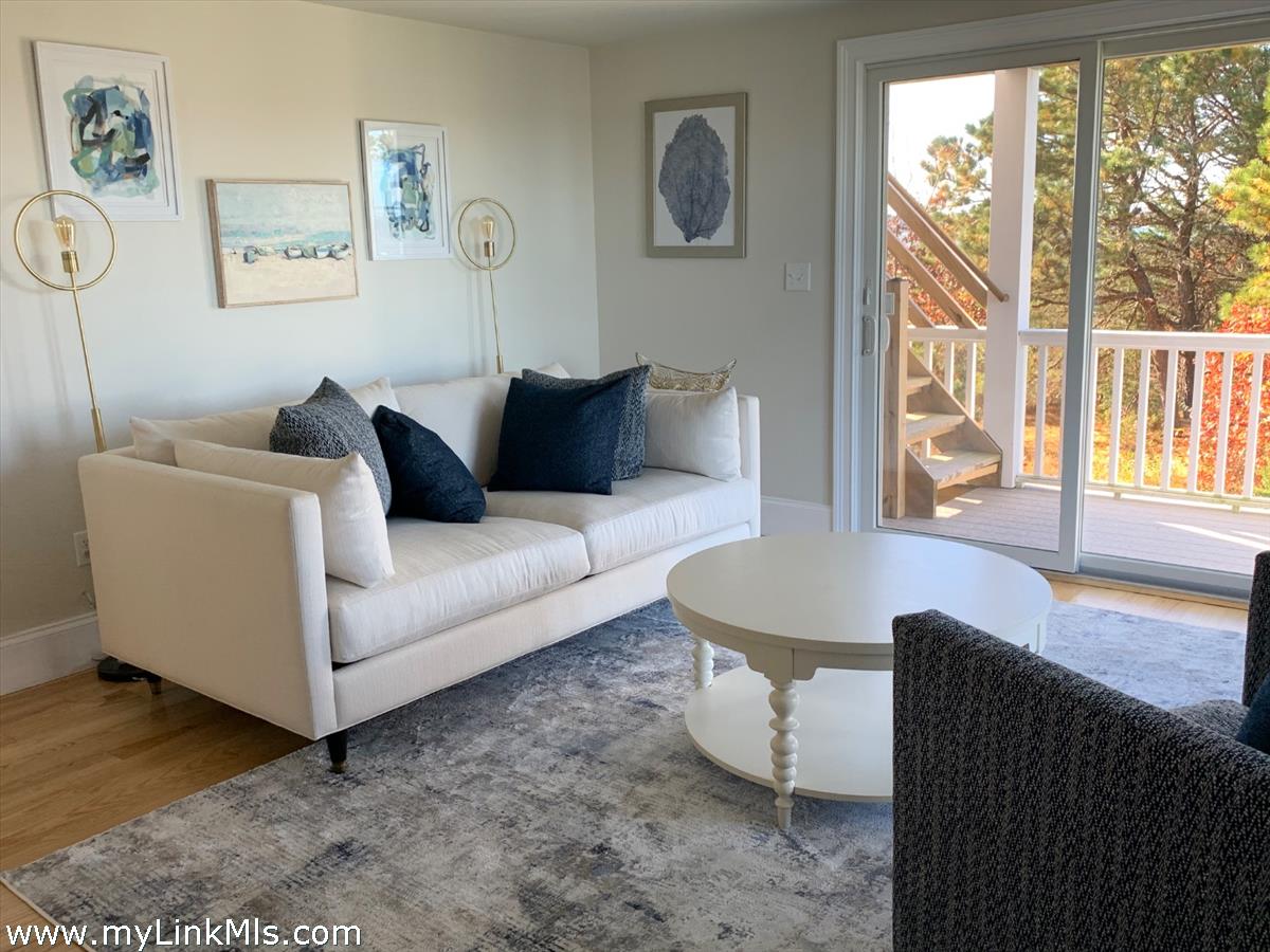 28 Beach Road Oak Bluffs, MA 02557 - Photo 10 of 32 a living room with furniture and a large window